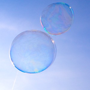 Two bubbles not touching in a blue sky - covid safe business practice